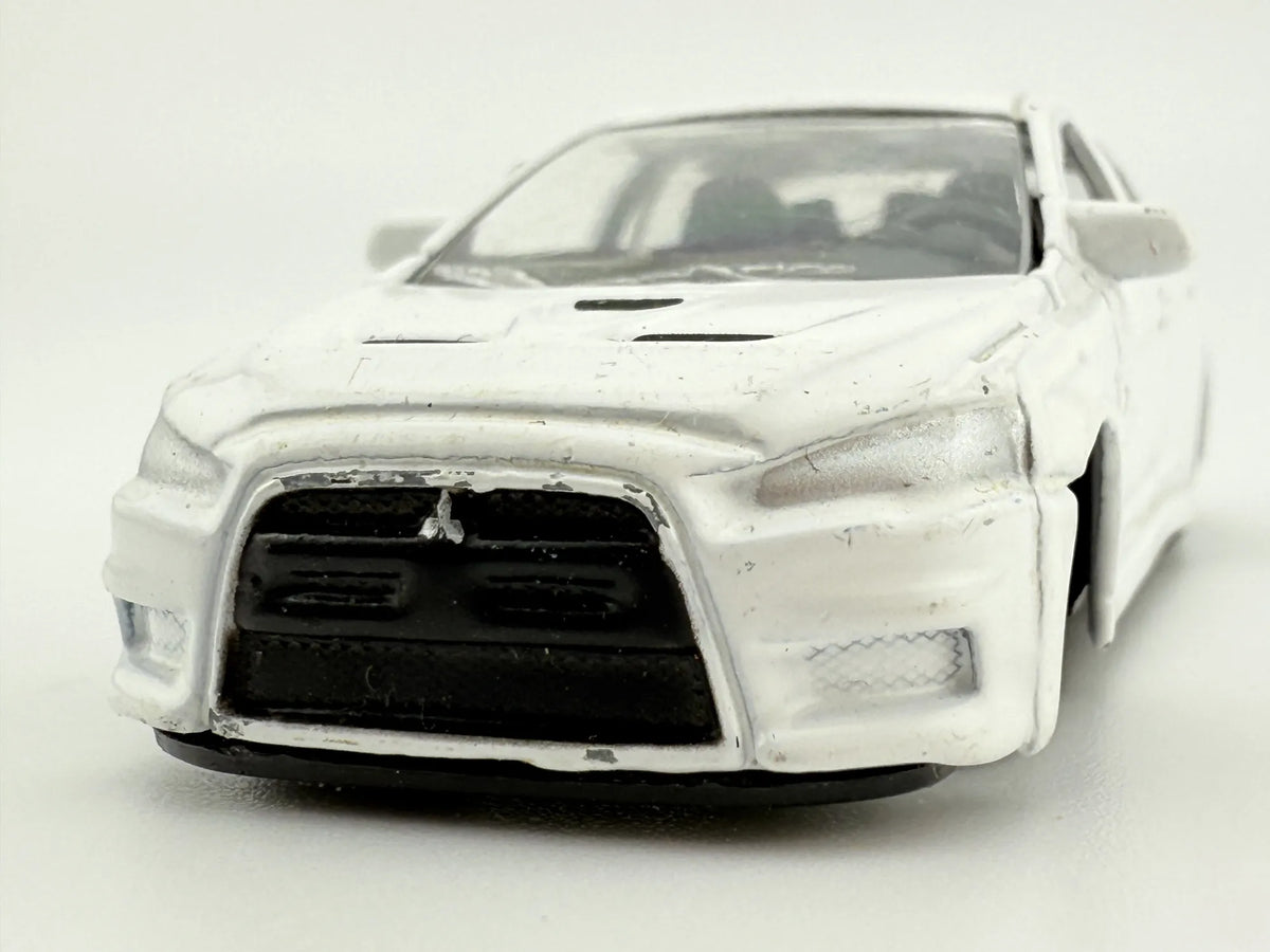 MITSUBISHI LANCER EVOLUTION, Bburago, Die cast 11524, Biały, 1:64, Resoraki – zdjęcie 4