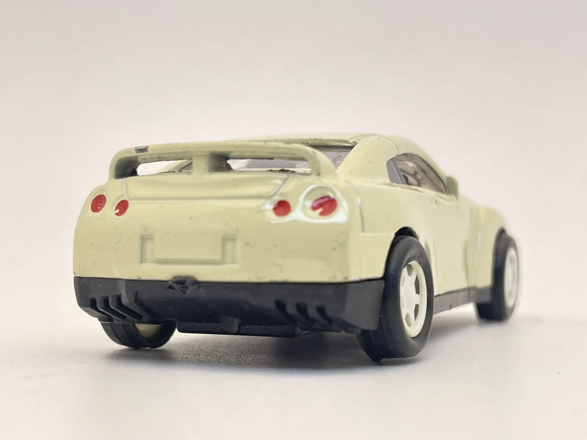 NISSAN GT-R, Inspiracja Autka Disney, Resoraki, Die cast, Kremowy 1:55 – zdjęcie 5