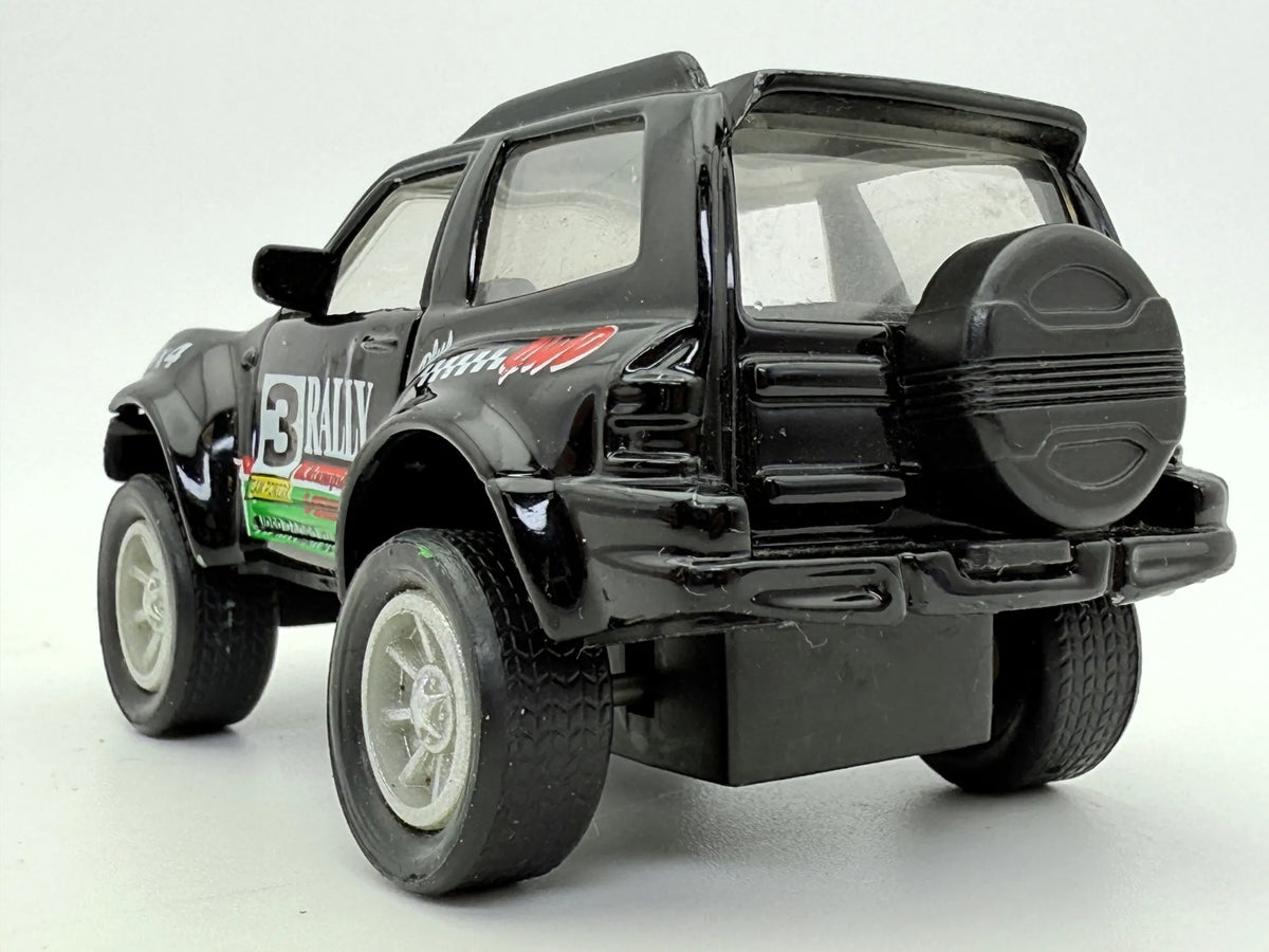Jak Mitsubishi Pajero Rally 4X4 Czarny 1:43 – zdjęcie 6