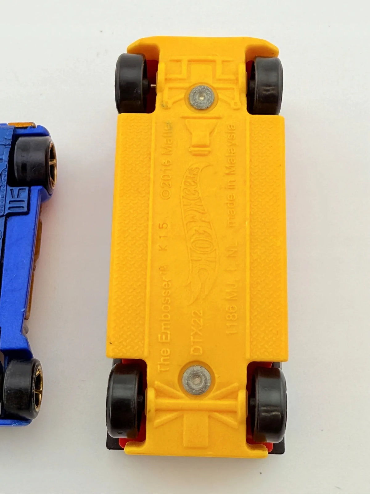 The Embosser Hot Wheels 2010 Żółty, 1:64 – zdjęcie 9