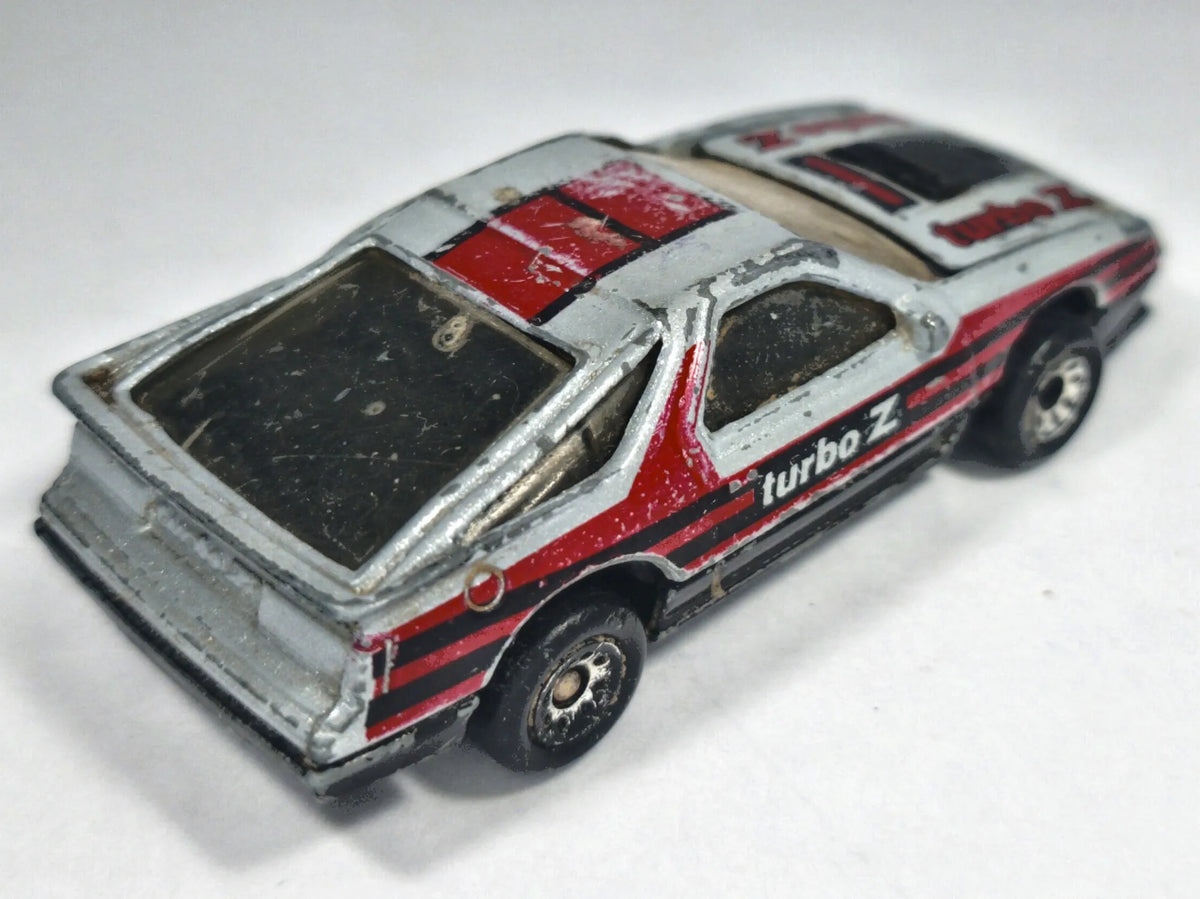 1984 DODGE DAYTONA TURBO Z, Matchbox, Die cast, Srebrny, 1:64, Resoraki – zdjęcie 3