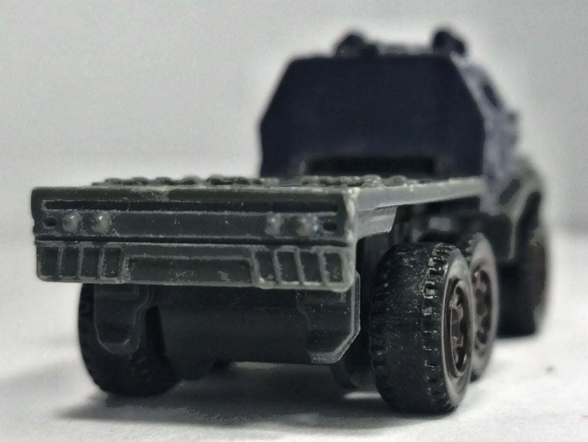 Ciężarówka Armored Action Transporter Wojsko Matchbox 2017 Granatowy 1:64 – zdjęcie 6