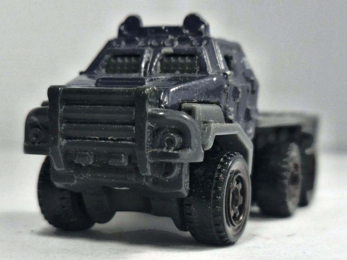 Ciężarówka Armored Action Transporter Wojsko Matchbox 2017 Granatowy 1:64 – zdjęcie 5